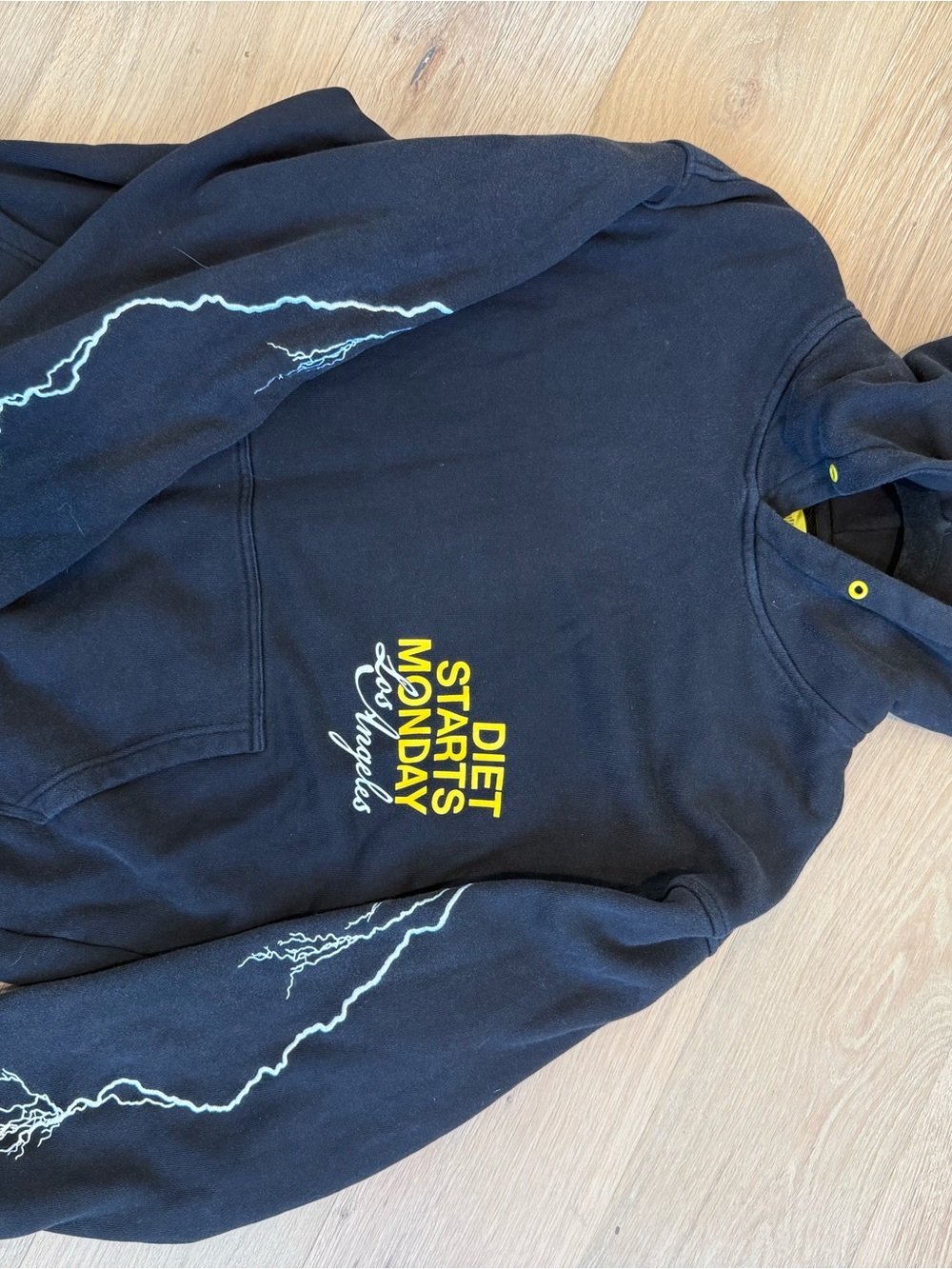 Black Hoodie with Yellow 'Diet Starts Monday' Graphic and Lightning Sleeves